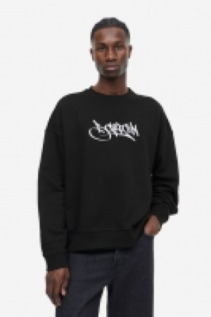 Sweatshirt mit Print Relaxed Fit CHF 31.95